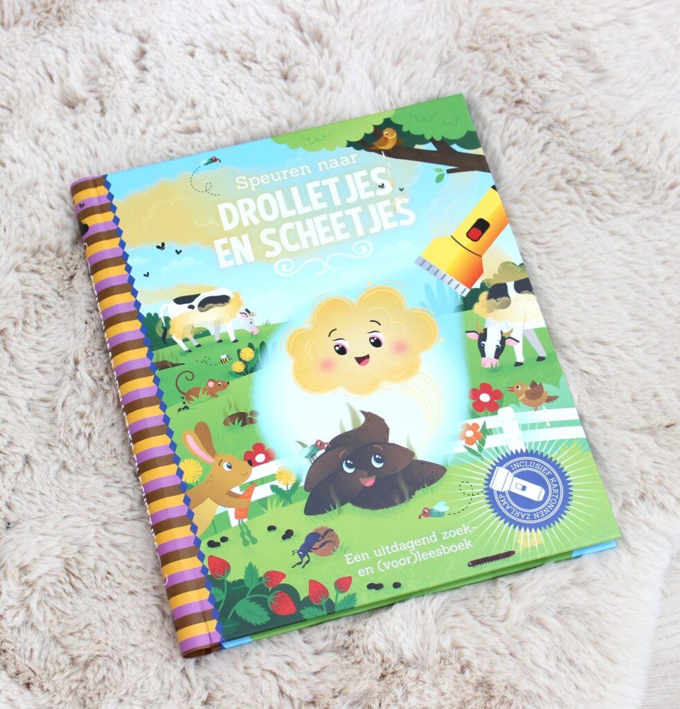 zaklampboek. Zoek met een kartonnen zaklamp droppeltjes en scheetjes op de zwarte pagina's